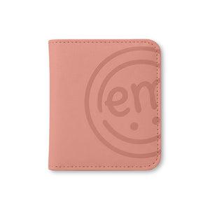 A cute, peach-colored storage case designed like a photo book to keep all your ExpressionMed sensor patches organized and easy to find.