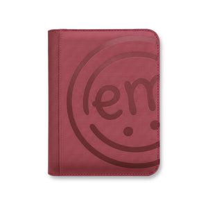 A deep burgundy wine-toned storage book that keeps your colorful ExpressionMed patches visible and neat.