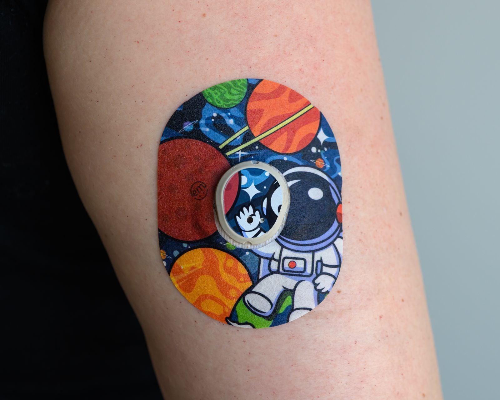 ExpressionMed Astronaut Dexcom G7 Tape, Single Tape and Single Sticker, Arm Wearing Austronaut Themed CGM Adhesive Patch Design