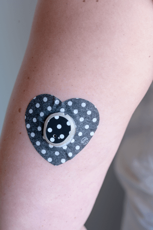 ExpressionMed, Black and White Polka Dots Dexcom G7 Heart Tape, Single Tape, Human Wearing Black and White Polka Dots in Heart Shaped CGM Adhesive Patch Design, Dexcom Stelo Glucose Biosensor System