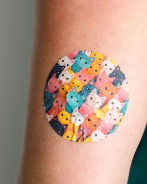 ExpressionMed, Rainbow Cats Dexcom G7 and Stelo Overpatch, Sticker Only, Human Wearing Rainbow Cats Themed CGM Adhesive Patch Design.