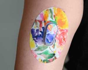 ExpressionMed, Floral Art Dexcom G6 Tape, Single Tape and Single Sticker, Human Arm Wearing Floral Art Designed CGM Adhesive Patch Design