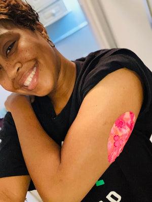 Medtronic Enlite / Guardian ExpressionMed Woman with pink hibiscus Universal Oval tape on arm
