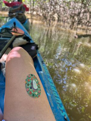 Sea Turtles Dexcom G6 Tape on leg of woman kayaking