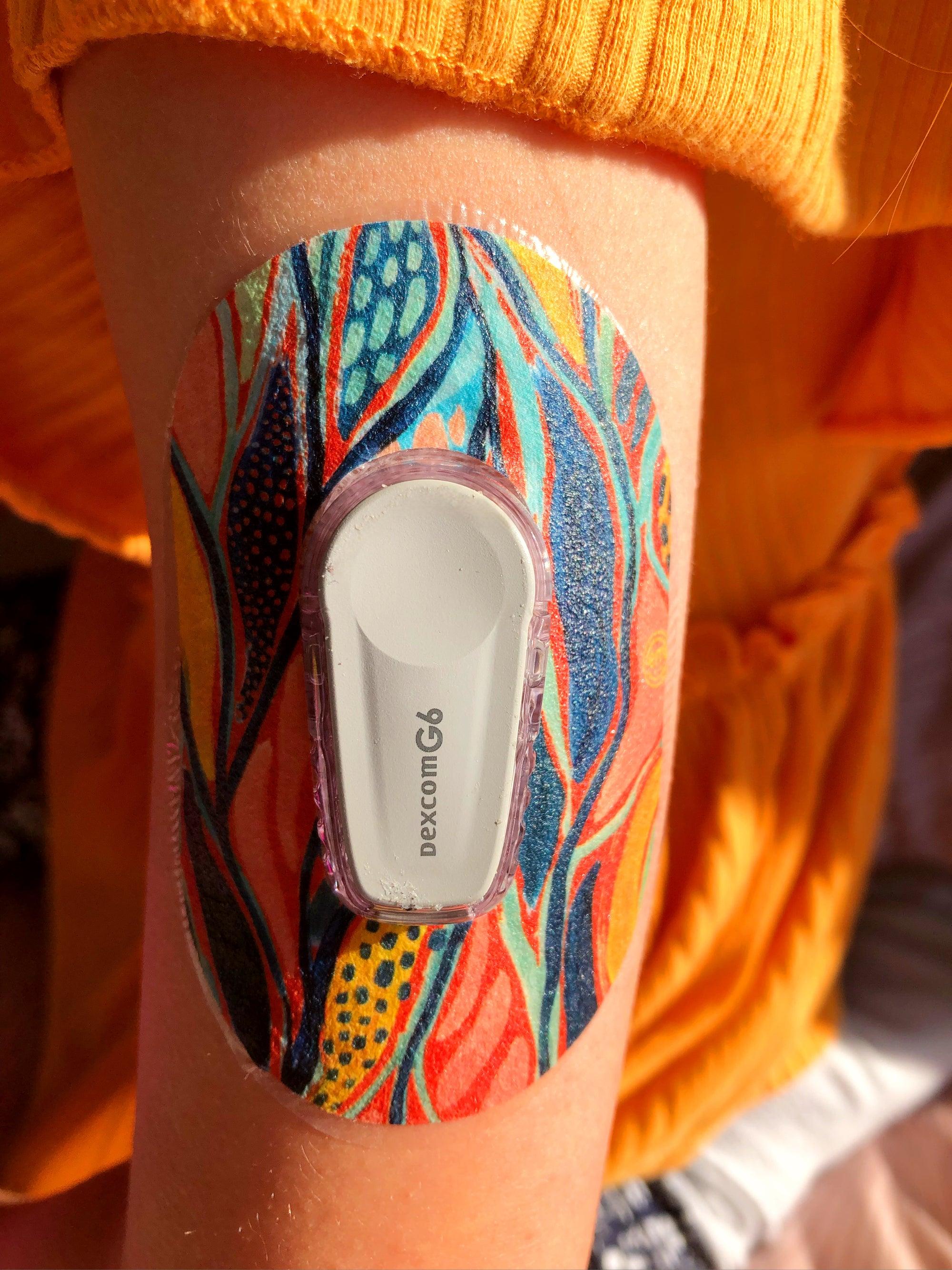 ExpressionMed OMG Orange Variety Pack Dexcom G6 Mini Tape, Single Tape, Arm Wearing Floral Themed CGM Adhesive Patch Design