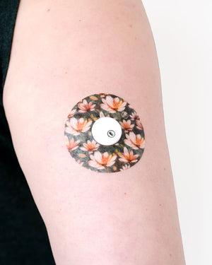 ExpressionMed Moody Moment Variety Pack Libre 3 Tape, Single Tape, Arm Wearing Floral Themed CGM Adhesive Patch Design