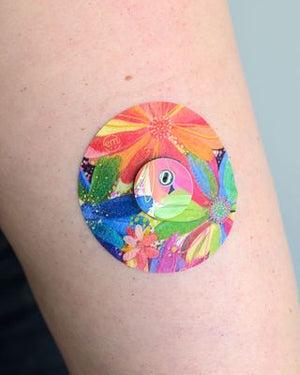 ExpressionMed, Flower Song Libre 3 Tape, Sticker and Tape, Human Arm Wearing Flower Song Designed CGM Adhesive Patch Design