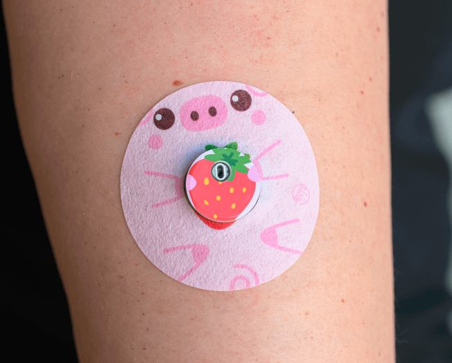 ExpressionMed, Strawberry Piglet Libre 3 Tape, Single Sticker and Single Tape, Human Arm Wearing Strawberry Piglet Designed CGM Adhesive Patch Design