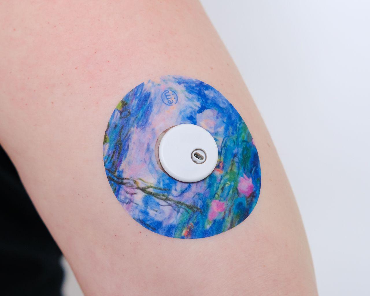 ExpressionMed Moody Blues Variety Pack Libre 3 Tape, Single Tape, Arm Wearing Floral Themed CGM Adhesive Patch Design