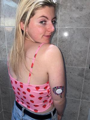Woman with wild berries libre tape on arm