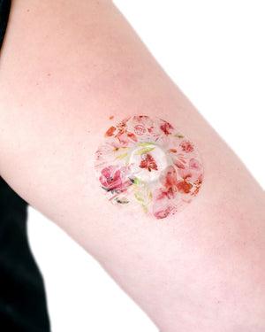 ExpressionMed Mixed Florals Variety Pack Libre 2 Overpatch, Single Tape, Arm Wearing Floral Themed CGM Adhesive Patch Design