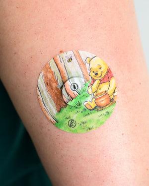 ExpressionMed, Winnie the Pooh Libre 3 Tape, Tape & Sticker, Human Wearing Winnie the Pooh Themed CGM Adhesive Patch Design