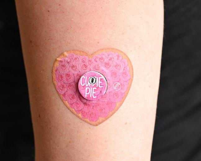 ExpressionMed, Cutie Pie Cookie Libre 3 Transmitter Sticker, Tape & Sticker, Human Wearing Cutie Pie Cookie Themed CGM Adhesive Patch Design