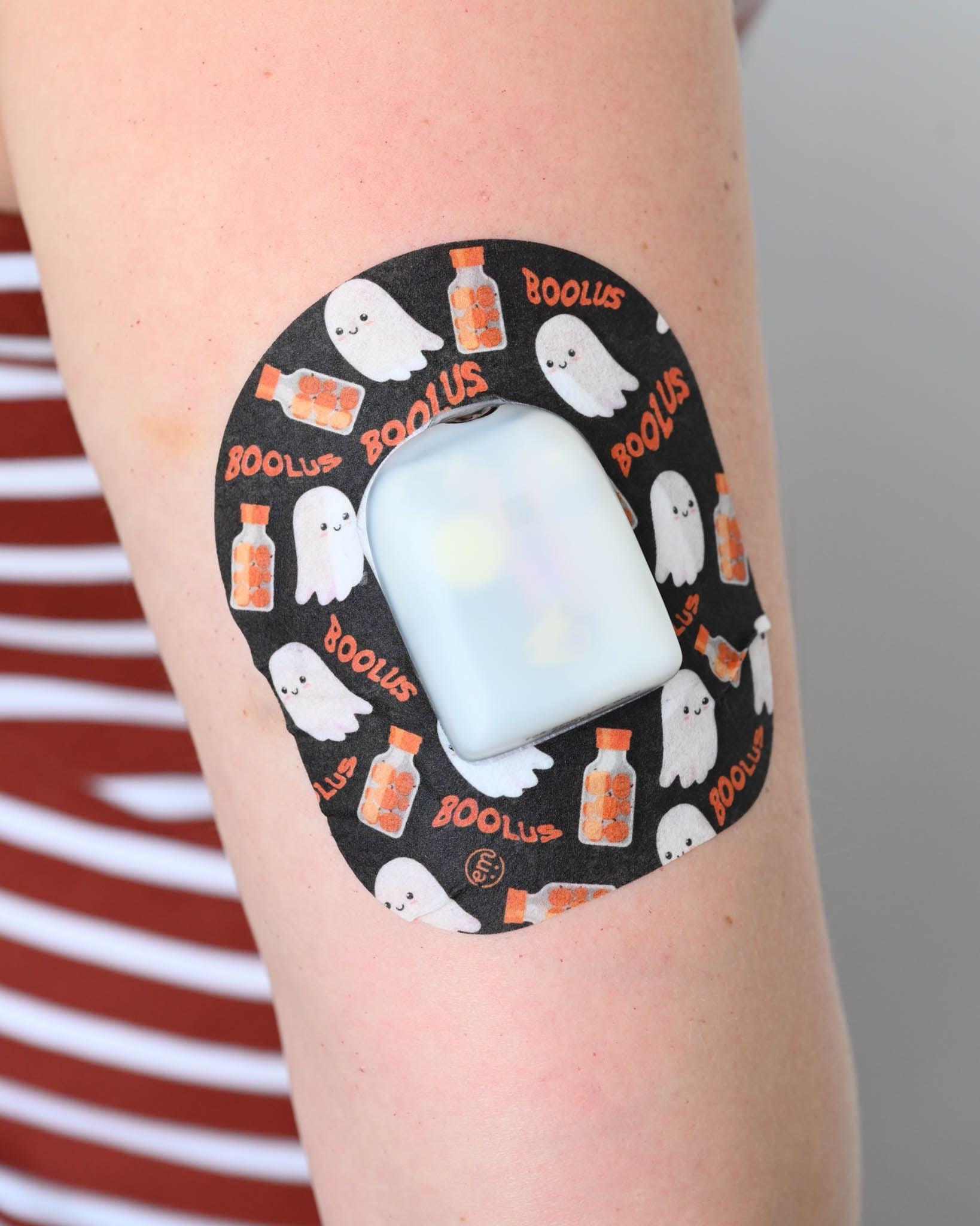 ExpressionMed, Trick or Treat Variety Pack Pod Tape, Single Tape, Bolus Insulin Bottles and Ghost Halloween Themed Omnipod Adhesive Patch Design on Human Arm 