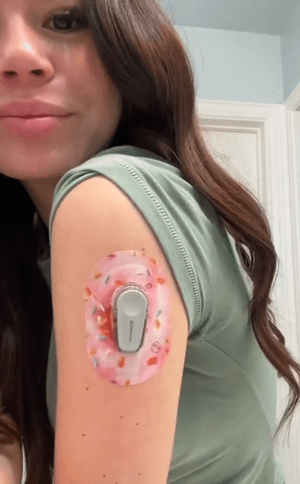 ExpressionMed Woman with Donut Sprinkles Dexcom G6 Mini Tape on arm
