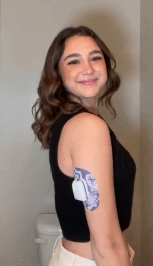 ExpressionMed Woman with Purple Henna Pod Tape on arm