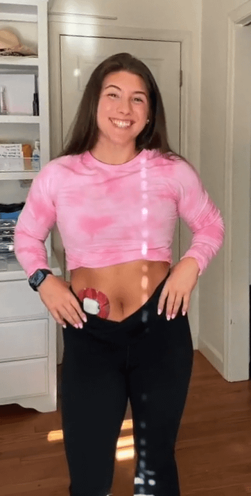 Woman with Brushed Glitter Pod Tape on stomach