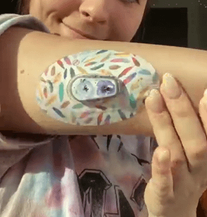 ExpressionMed Woman with Feathers Dexcom G6 Tape on arm