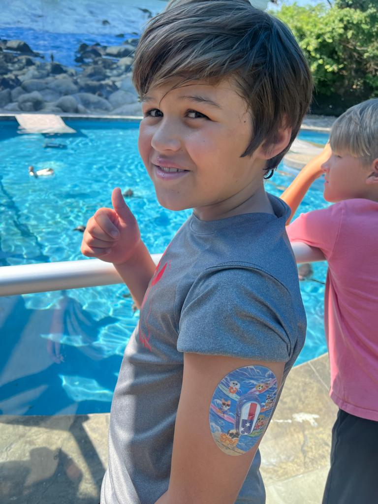 ExpressionMed Surfing Dogs Dexcom G6 Tape, Single Tape and Single Sticker, Boy Wearing Surfing Themed CGM Adhesive Patch Design