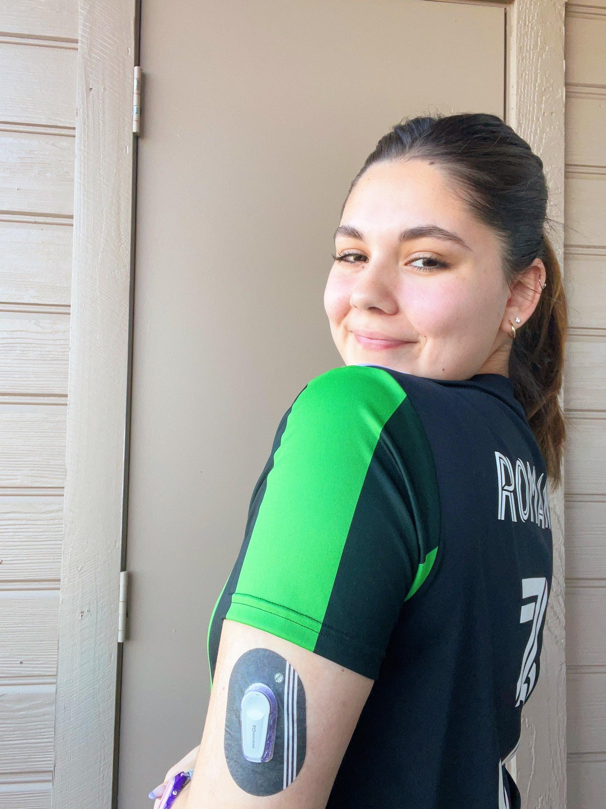 Girl with Sporty Dexcom G6 Tape on arm