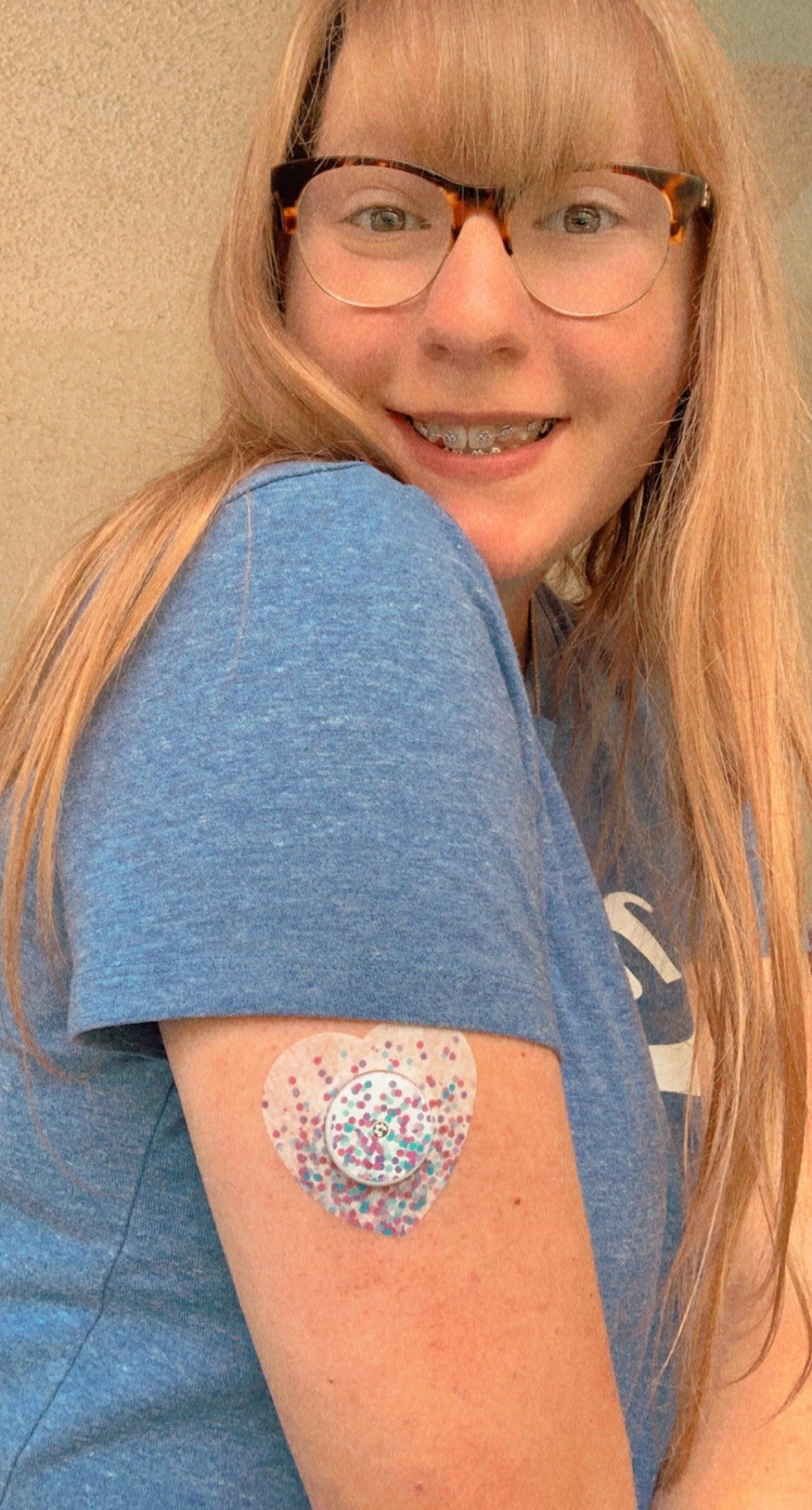 Girl with Confetti Libre Heart Tape and Transmitter Sticker on arm