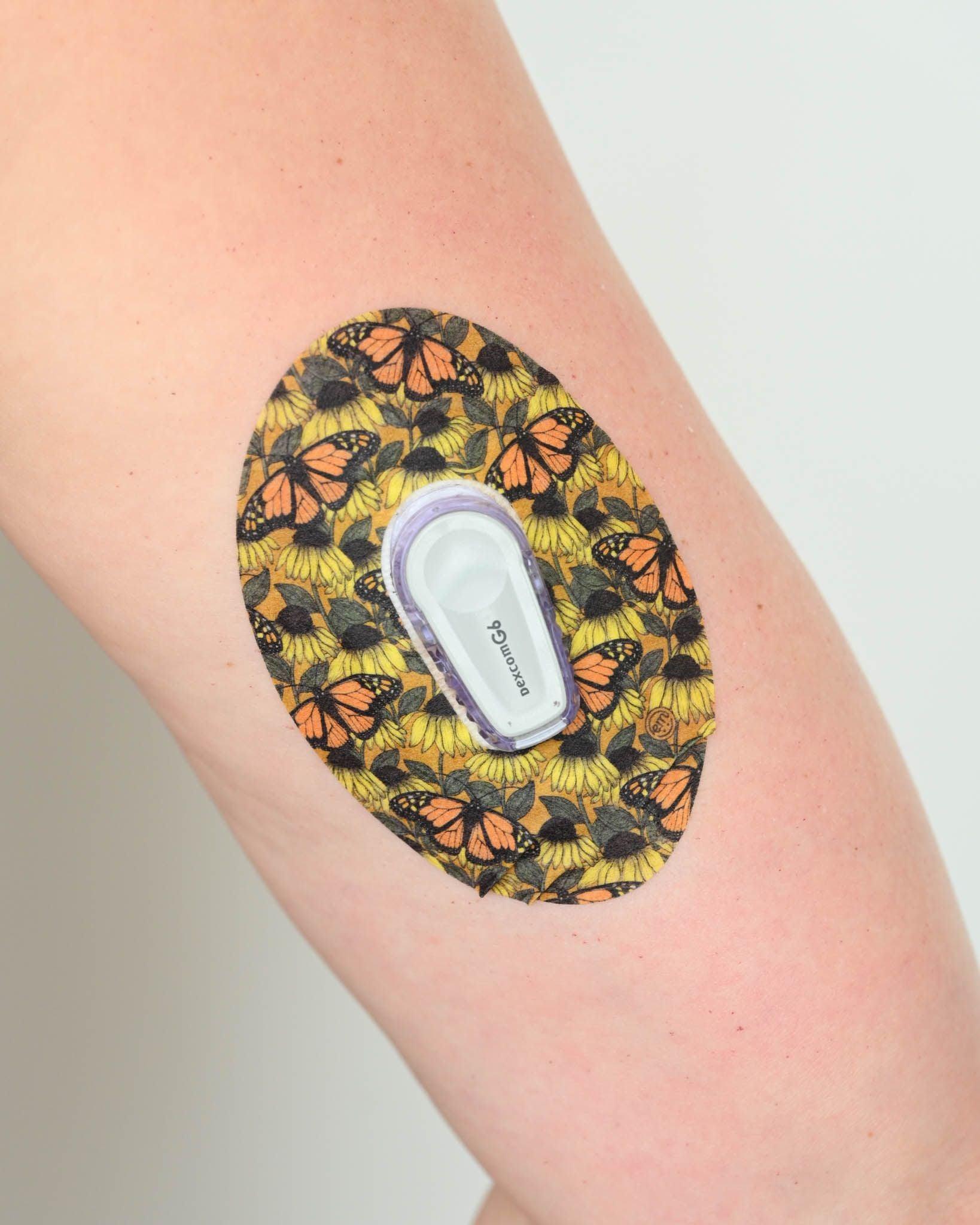 ExpressionMed, Sunburst Variety Pack Dexcom G6 Tape, Single Tape, Arm Wearing Butterfly Themed CGM Adhesive Patch Design